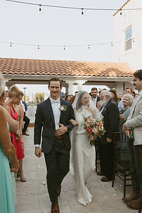 Couple walking together at a wedding